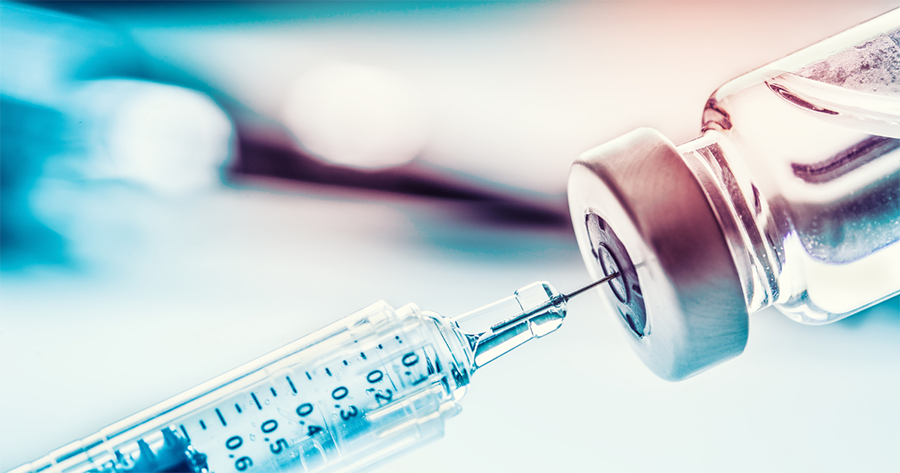 A shingles vaccine is drawn with a needle from a clear vial, now covered by the inflation reduction act, or ira