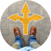 A person with dirty blue jeans stands above a yellow arrow, point straight ahead, to the left and the right, representing the decisions about work, accommodations, leave, disability and retirement.