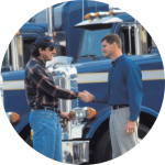 A long-haul trucker shakes hands with his boss when he tells him he's leaving his job.