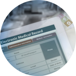 Accessing Medical Records - an electronic medical record with hard copy files behind it.