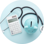 A blue piggy bank sitting next to a calculator and a stethoscope