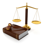 A law book, gavel, and the scales of justice.