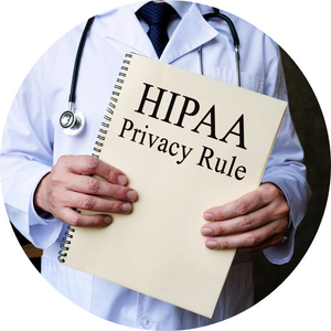A doctor in a white lab coat holds up a booklet that says "HIPAA Privacy Rule" on the front of it.