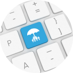 A keyboard with a bright blue key that has an umbrella with a family standing under it.