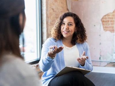 Community health worker speaks with [atient