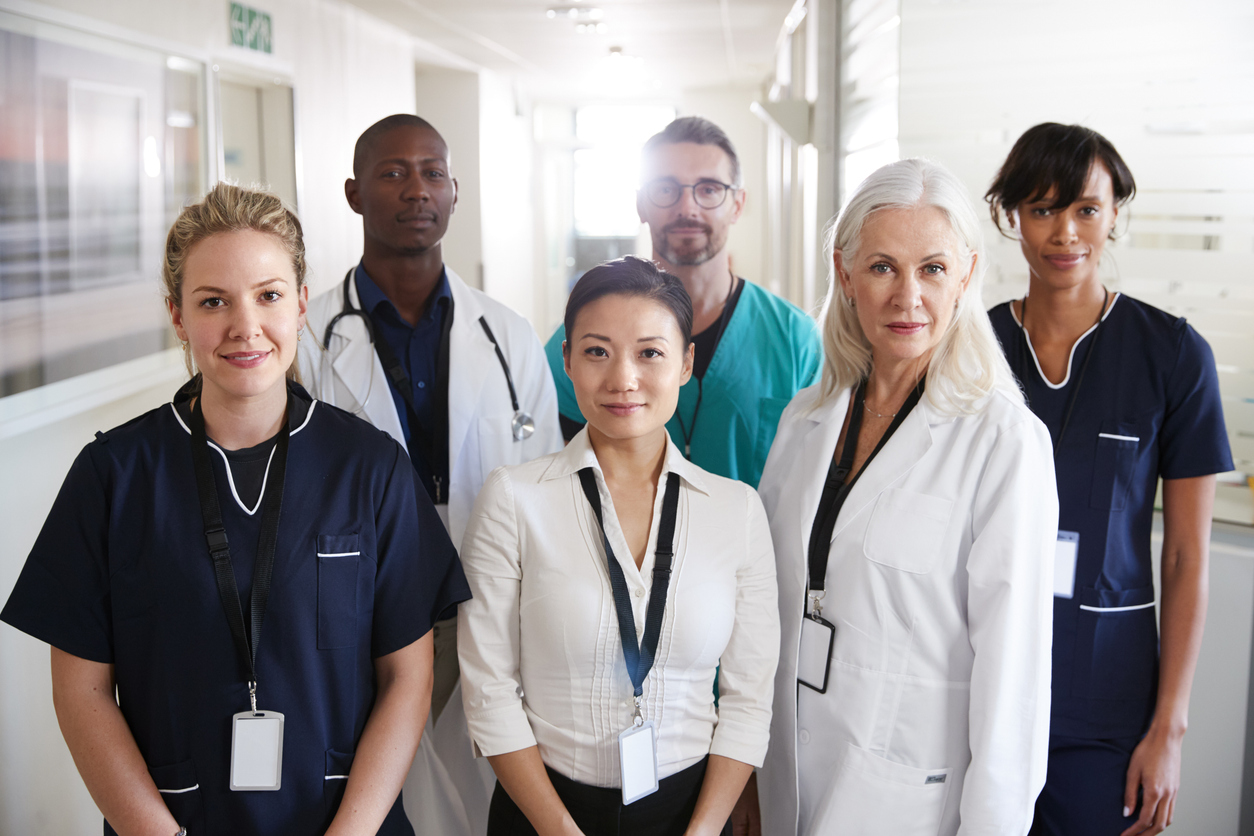 A group of health care professionals in a hallway