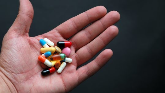 Person holds Revlimid pills that may not be covered by Medicare or Medicare Advantage plan