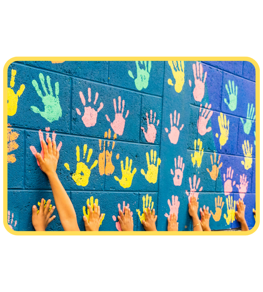 Teal brick wall with different color handprints from teens and young adults