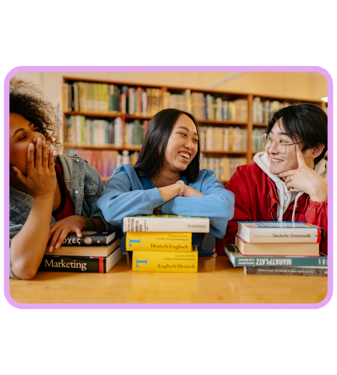 3 college students laughing and discussing topics